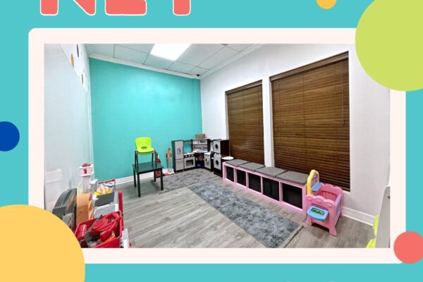Bright and colorful playroom with toys and seating.